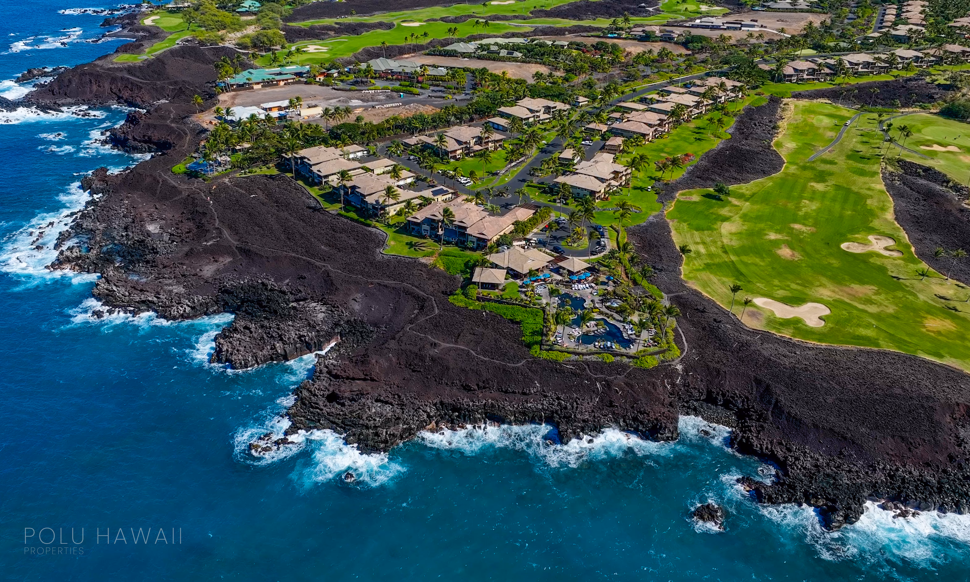 Aerial view of Haliʻi Kai's oceanfront residences along the black lava coastline at Waikoloa Beach Resort, Hawaiʻi Island