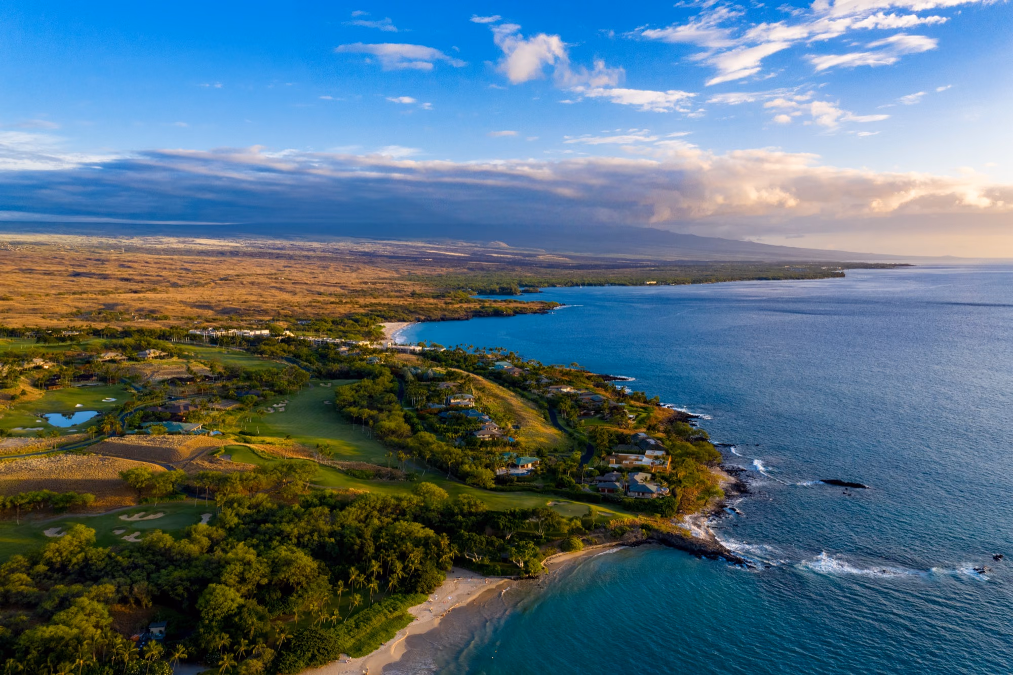 Aerial view of oceanfront luxury homes along the Kohala Coast of Hawaiʻi Island