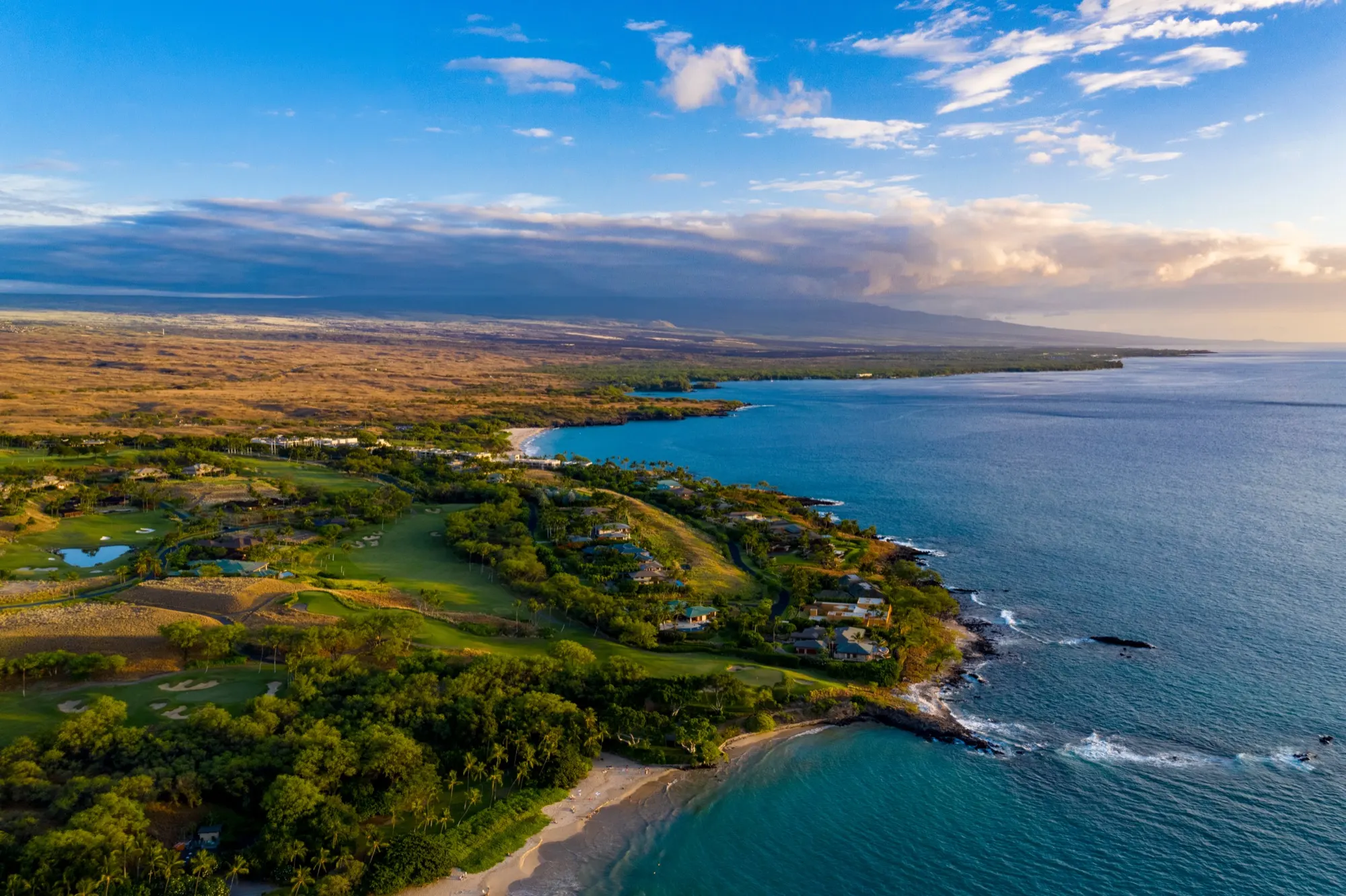 Aerial view of oceanfront luxury homes along the Kohala Coast of Hawaiʻi Island