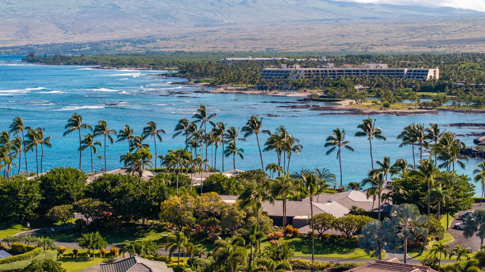 Aerial view of oceanfront resorts and condominiums along the Kohala Coast of Hawaiʻi Island